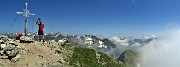 57 In vetta al Crono Stella (2620 m), sereno sulle alte cime orobiche,nuvoloso verso la Val Brembana